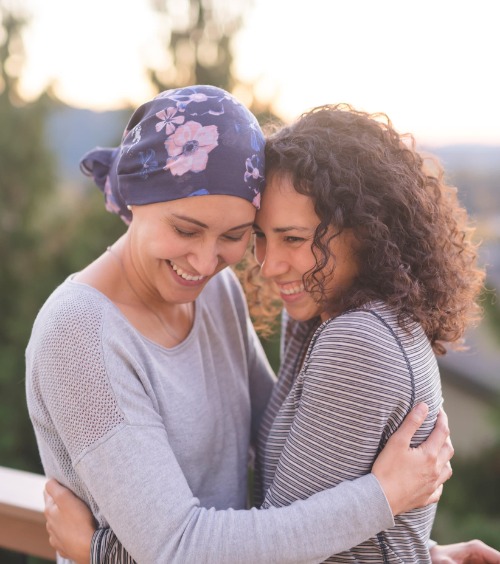 cancer patient hugging friend