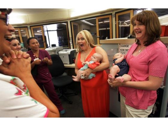 women holding infants