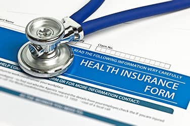 insurance form with stethescope
